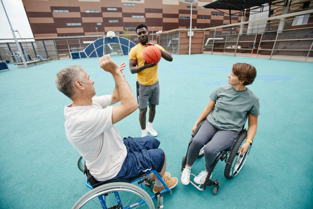 Couple with disability learning to play basketball